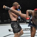 ABU DHABI, UNITED ARAB EMIRATES - JULY 19: In this handout image provided by UFC, (R-L) Marc Diakiese of the Democratic Republic of the Congo kicks Rafael Fiziev of Kazakhstan in their lightweight bout during the UFC Fight Night event inside Flash Forum on UFC Fight Island on July 19, 2020 in Yas Island, Abu Dhabi, United Arab Emirates. (Photo by Jeff Bottari/Zuffa LLC via Getty Images)