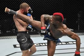 ABU DHABI, UNITED ARAB EMIRATES - JULY 19: In this handout image provided by UFC, (R-L) Marc Diakiese of the Democratic Republic of the Congo kicks Rafael Fiziev of Kazakhstan in their lightweight bout during the UFC Fight Night event inside Flash Forum on UFC Fight Island on July 19, 2020 in Yas Island, Abu Dhabi, United Arab Emirates. (Photo by Jeff Bottari/Zuffa LLC via Getty Images)
