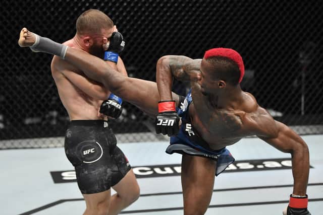ABU DHABI, UNITED ARAB EMIRATES - JULY 19: In this handout image provided by UFC, (R-L) Marc Diakiese of the Democratic Republic of the Congo kicks Rafael Fiziev of Kazakhstan in their lightweight bout during the UFC Fight Night event inside Flash Forum on UFC Fight Island on July 19, 2020 in Yas Island, Abu Dhabi, United Arab Emirates. (Photo by Jeff Bottari/Zuffa LLC via Getty Images)