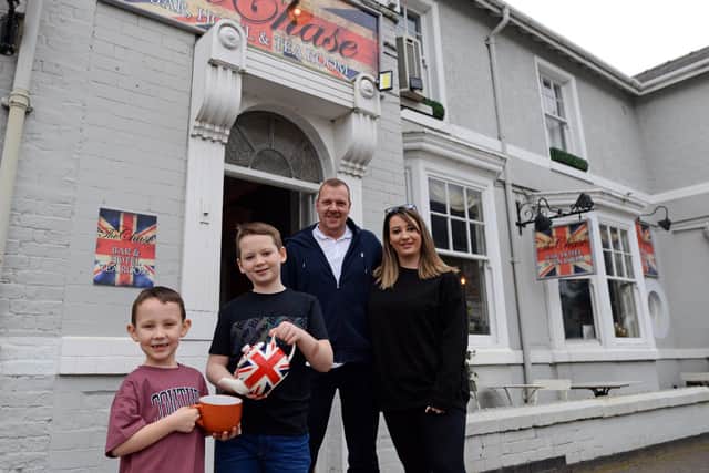 Jade Moore and Mark Watson, pictured with sons, Freddie, six and Alfie, ten, outside The Chase Tea Rooms, in Bawtry. Picture: NDFP-02-03-21-TheChase 1-NMSY