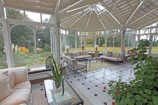 The conservatory is by Amdega and runs the full depth of the house, it has a tiled floor, door to the garden and offers "excellent" seating and entertaining space.