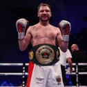 Maxi Hughes, pictured with his IBO World lightweight title, celebrates beating Ryan Walsh in March. Photo courtesy of Mark Robinson/Matchroom Boxing.