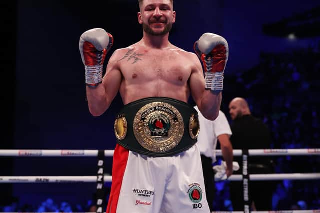 Maxi Hughes, pictured with his IBO World lightweight title, celebrates beating Ryan Walsh in March. Photo courtesy of Mark Robinson/Matchroom Boxing.