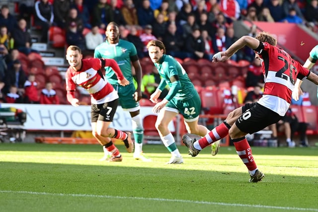 Doncaster Rovers' Joe Ironside scores a penalty past Sutton United's Dean Bouzanis.