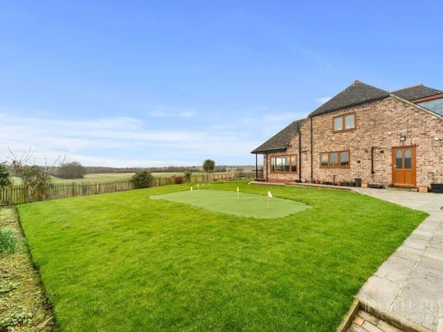 Looking back towards the house from the garden with putting green.