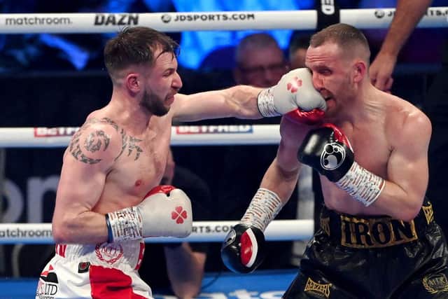 LEEDS, ENGLAND - MARCH 26: Maxi Hughes (L) punches Ryan Walsh during the IBO World Lightweight Title fight between Maxi Hughes and Ryan Walsh at First Direct Arena on March 26, 2022 in Leeds, England. (Photo by Stu Forster/Getty Images)
