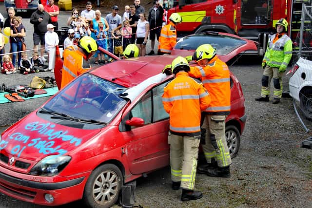 Firefighters demonstrate a car accident