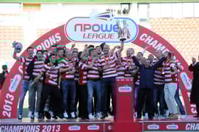 Rovers celebrate with the League One trophy