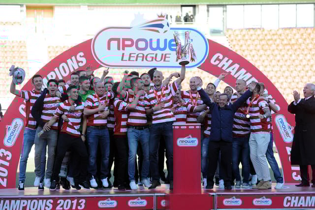 Rovers celebrate with the League One trophy