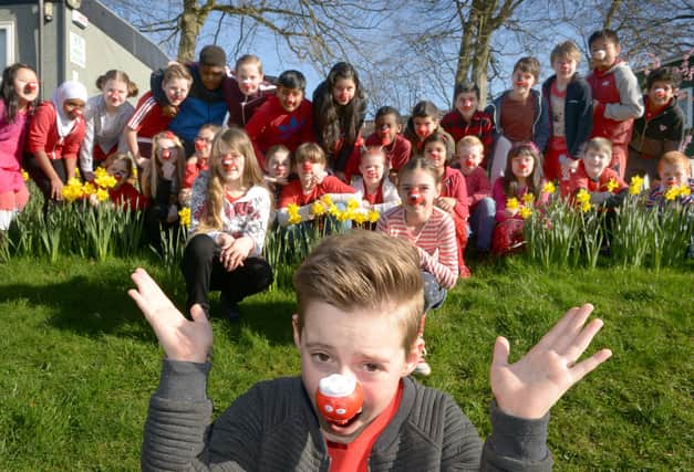 Pupils at Lydgate Junior School fundraising for Comic Relief. Class 5RJ with Zack Thompson, who was having his head shaved in assembly in 2017