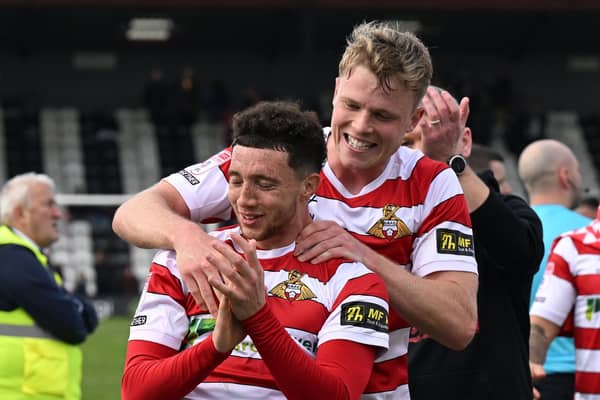 Jordan Gibson laps up the acclaim from the Rovers fans at full-time.