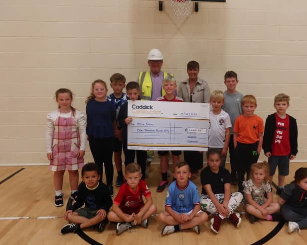 Caddick representatives hand over the cheque for Active Fusion