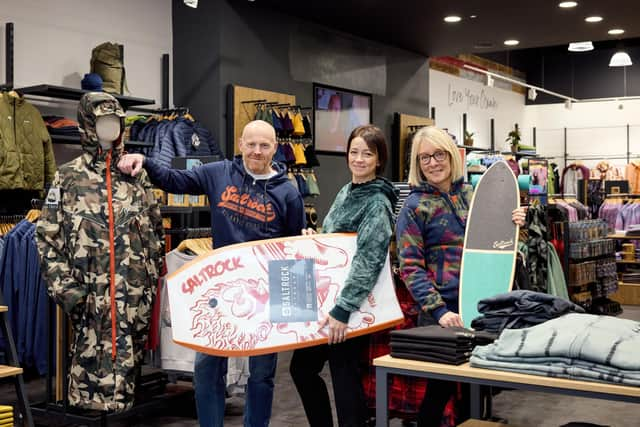 Saltrock store manager, Mick Bell, joins Abby Chandler and Marie Beech from Lakeside Village at the centre’s new Saltrock store.Pix: Shaun Flannery/shaunflanneryphotography.com