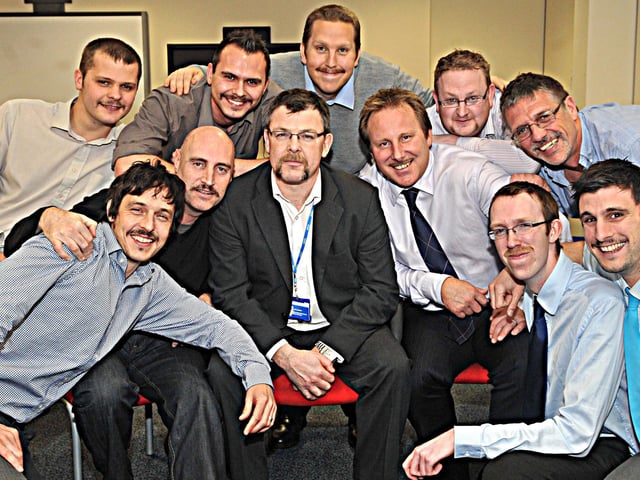 Pictured at Doncaster NHS, 14 team workers at the Doncaster NHS offices at Gresley House Ten Pound Walk Doncaster , are all sported moustaches of various styles and size to raise money for men's health charities in 2011