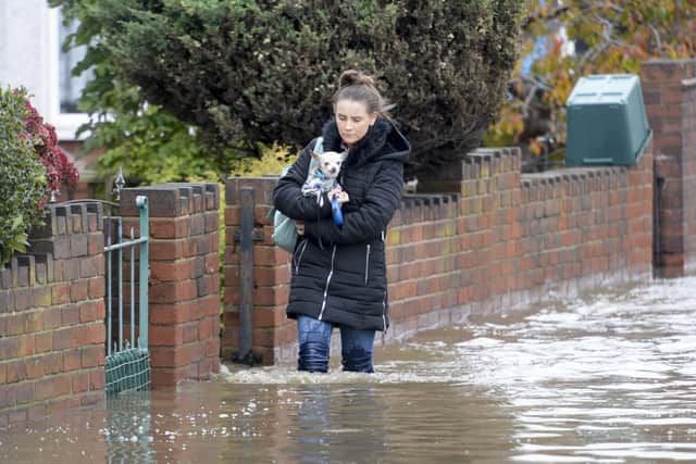 Residents on Yarborough Terrace in Doncaster flee their homes as flood waters rise in the area following heavy rain