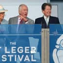 King Charles III and Queen Camilla with racing adviser John Warren (right) watch the action during the Betfred St Leger Festival at Doncaster Racecourse. Photo credit: Danny Lawson/PA Wire