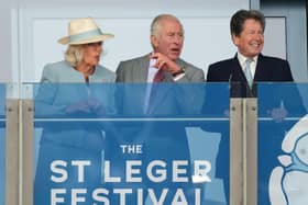 King Charles III and Queen Camilla with racing adviser John Warren (right) watch the action during the Betfred St Leger Festival at Doncaster Racecourse. Photo credit: Danny Lawson/PA Wire