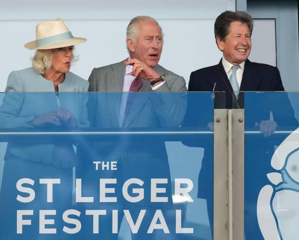 King Charles III and Queen Camilla with racing adviser John Warren (right) watch the action during the Betfred St Leger Festival at Doncaster Racecourse. Photo credit: Danny Lawson/PA Wire