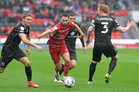 Ben Close drives forward against MK Dons. Picture: Andrew Roe/AHPIX