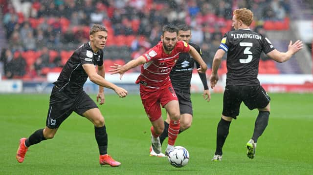 Ben Close drives forward against MK Dons. Picture: Andrew Roe/AHPIX