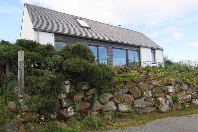This unique open-plan property has been designed to maximize the unrestricted panoramic views across Loch Snizort and to the Trotternish peninsula in the east. Located on the popular Waternish Peninsula on the northwest tip of Skye, the property features stylish features and modern designs. Currently on sale for 195,000 GBP via Remax Skye.