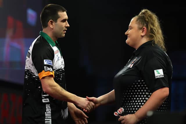 LONDON, ENGLAND - DECEMBER 16: William O'Connor of Ireland and Beau Greaves of England  shake hands after their First Round match against during Day Two of The Cazoo World Darts Championship at Alexandra Palace on December 16, 2022 in London, England. (Photo by Luke Walker/Getty Images)