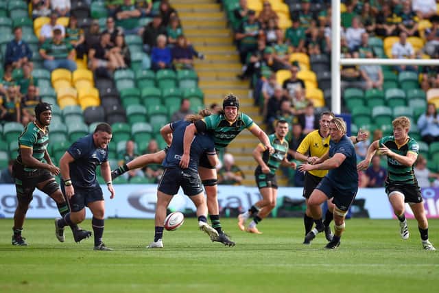 Alex Moon of Northampton Saints is tackled by Connor Davidson of Doncaster Knight during the Premiership Rugby Cup match between Northampton Saints and Doncaster Knights at cinch Stadium at Franklin's Gardens on October 08, 2023 in Northampton, England. (Photo by Graham Chadwick/Getty Images)