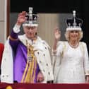 King Charles III and Queen Camilla on the balcony of Buckingham Palace following the coronation on May 6, 2023. Picture: Owen Humphreys/PA Wire.