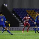 James Coppinger watches his shot loop home in the dying moments to rescue a point for Rovers at AFC Wimbledon. Picture: Howard Roe/AHPIX