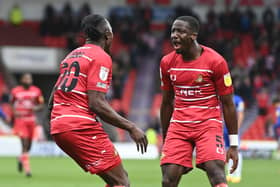 Joe Dodoo celebrates his goal against Cheltenham with Joseph Olowu. Photo: Howard Roe/AHPIX LTD