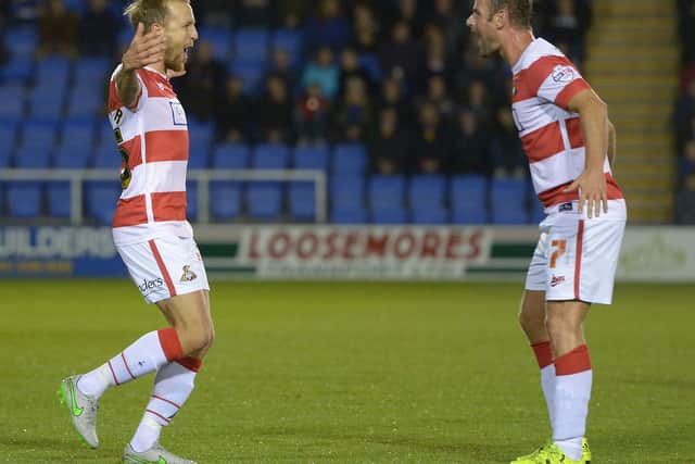 James Coppinger celebrates a goal with Richie Wellens