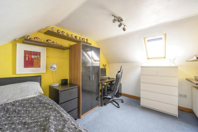 Bedroom 3 - A double room with a double glazed roof window and a central heating radiator.