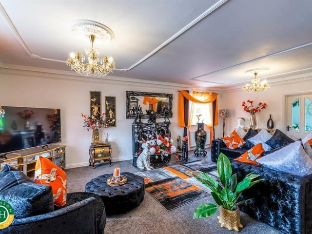 A spacious reception room with ornate decorative detail.