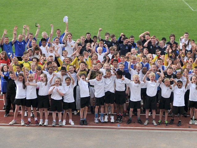 All students and assistants at an interschool sports day held by Danum Academy at Keepmoat Athletic Track (July 2012)