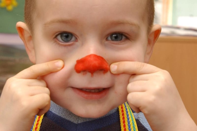 Three-year-old Kieron Preddy getting ready for Red Nose Day 2005 at Little Winns Nursery, Winn Gardens, which was built with Comic Relief funding