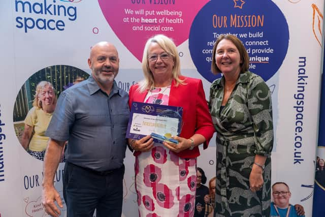 Patricia (centre) receiving her Making Space award last year.