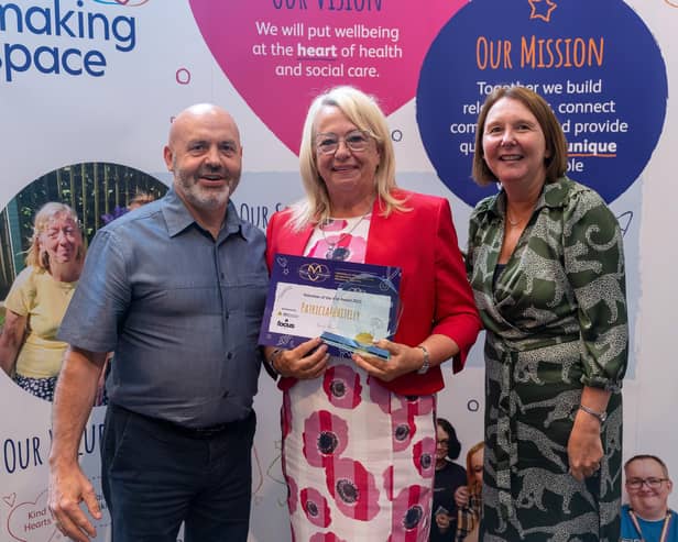 Patricia (centre) receiving her Making Space award last year.