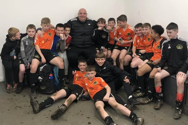 Shaun (centre) pictured with the Under-12s team following their recent 6-0 win over Wakefield.