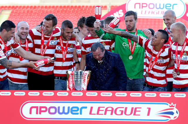 Doncaster Rovers celebrate winning the League One title in 2013