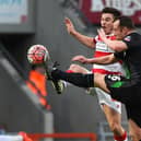 Harry Middleton of Doncaster Rovers battles Stoke CIty's Charlie Adam (photo by Laurence Griffiths/Getty Images).