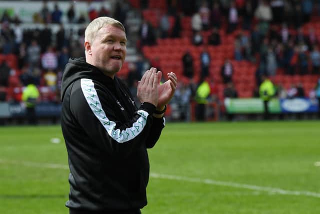 Grant McCann drinks in the atmosphere after the Bradford win. Pic: Jonathan Gawthorpe