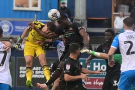 Doncaster Rovers pair Louis Jones and Joseph Olowu go up for a header in the final minute at Barrow.
