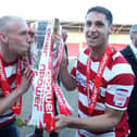 Dean Furman celebrates winning the League One title alongside David Cotterill