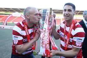 Dean Furman celebrates winning the League One title alongside David Cotterill