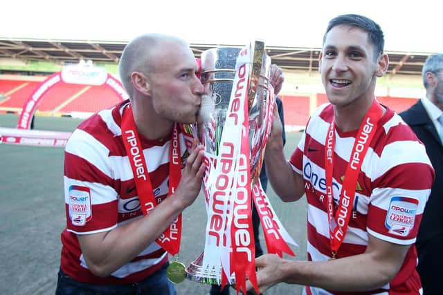 Dean Furman celebrates winning the League One title alongside David Cotterill