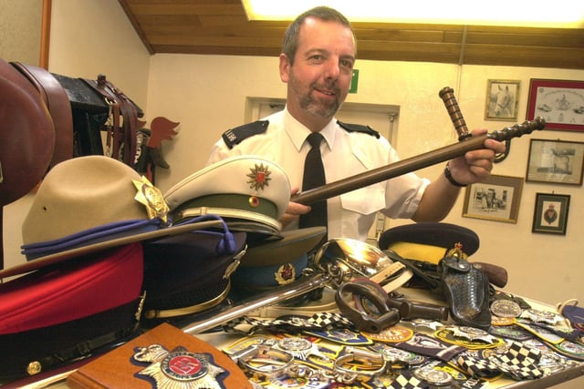 PC Paul Brown of the South Yorkshire Police Mounted section Ring Farm Cudworth pictured with some of his collection of Police memorabilia from around the world.