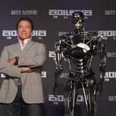 'The Terminator' (left) who was played on film by Arnold Arnold Schwarzenegger. Photo: Chung Sung-Jun/Getty Images.