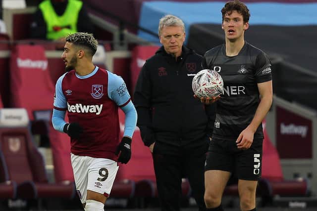 Joe Wright prepares to take a throw in against West Ham as Hammers boss David Moyes looks on. Picture: Gareth Williams/AHPIX