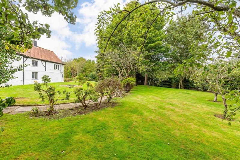 The property has an annexe and half an acre of stunning gardens.