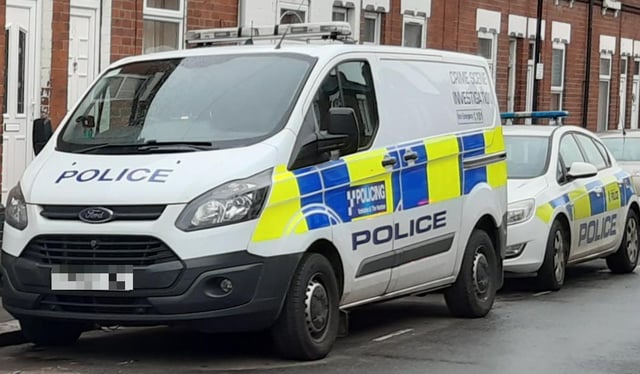 Police vehicles respond to a crime